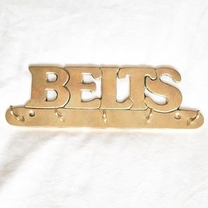 Brass "belts" wall hanger
